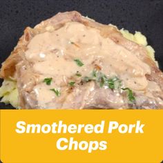 a close up of food on a plate with the words smothered pork chops