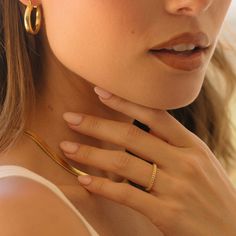 Our Ribbed Gold Filled ring is a modern twist on your simple gold band. The perfect stacking companion. A new look made for ring stacking. Our 14k gold-filled jewelry is bonded with 14k gold and is water and tarnish resistant. 14k gold-filled jewelry is a great alternative to solid gold, and can be worn by people with sensitive skin. The color will not tarnish but recommend to keep away from perfumes and lotions. - 14k gold-filled- Band width: 2mm.- Waterproof, tarnish resistant & hypoallergenic Gold Plated Hoop Rings For Everyday, Minimalist Everyday Bands Tarnish Resistant, Minimalist 14k Gold Filled Tarnish Resistant Midi Rings, Minimalist Gold Plated Thick Band Jewelry, Everyday 14k Gold Filled Tarnish Resistant Rings, Modern 14k Gold Filled Stackable Rings, Modern Stackable 14k Gold Filled Rings, Gold Plated Stackable Rings For Everyday, Minimalist 14k Gold Filled Hoop Ring