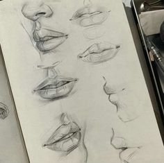 several different types of lips drawn in pencil on paper next to a pen and scissors