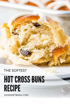 the softest hot cross buns recipe on a white plate with text overlay