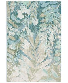 a blue and green rug with leaves on it