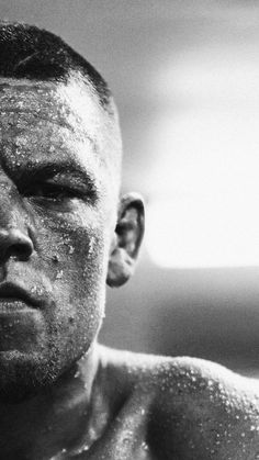 a black and white photo of a man's face covered in powdered sugar