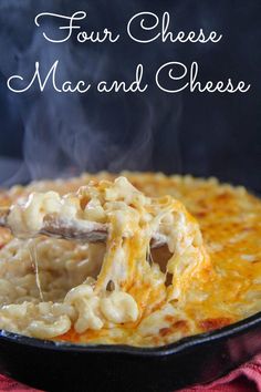 the macaroni and cheese is being cooked in a skillet with a spoon