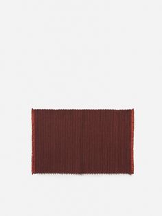 a brown and red striped cloth on a white background