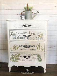 an old dresser has been painted with flowers and plants