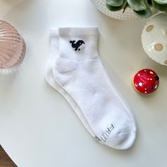 These hand-embroidered ankle socks feature an adorable cross-stitched Orca whale 🐳  Perfect for you or someone you know that loves animals and marine-life, or just likes wearing fun socks -- these are a super cute and unique addition to any outfit! ✨ Socks are each hand-stitched (with love) upon order 💘 Due to the items being made to order, processing times may take up to a week (but I do my very best to get them shipped out to you as fast as possible!) Caring for your hand-embroidered socks: The embroidery holds up very well in the washing machine, but for best results: Wash in cold water on the delicate cycle by themselves. Dry on the lowest temperature setting, also delicate if your dryer has the option.  Sock Information: Style: Fruit of the Loom All Day Comfort Ankle Socks Size: One Cute Orca, Embroidered Socks, Orca Whale, Embroidered Cross, Socks Cute, Orca Whales, Fun Socks, Cool Socks, Casual Socks