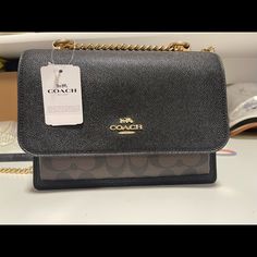 New And Never Used High-end Black Flap Bag With Gold-tone Hardware, High-end Black Flap Bag With Dust Bag, High-end Black Flap Bag For Travel, High-end Black Crossbody Shoulder Bag, High-end Black Flap Bag, High-end Black Rectangular Flap Bag, Black Flap Bag With Branded Hardware For Shopping, High-end Black Satchel Flap Bag, Black High-end Satchel Flap Bag