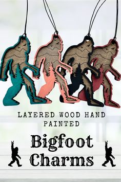 three wooden ornament shaped like bigfoot charms