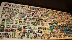 a table covered with lots of different sports cards