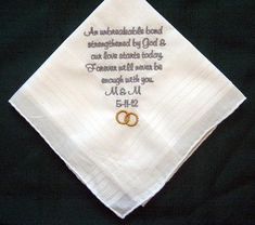 a wedding handkerchief with two rings on it