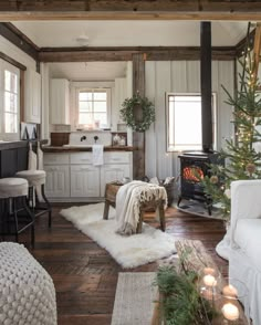 a living room filled with furniture and a fire place in the middle of a kitchen