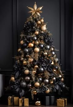 a black and gold christmas tree with presents