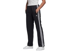 adidas Originals Firebird Track Pants - Women's Workout : Black 2 : The '90s-inspired adidas Originals Firebird Track Pants feature pintucks on the legs and a signature sheen that lends a throwback look. Regular fit track pants are not tight and not loose, the perfect in-between fit. Soft poly tricot features 3-Stripes detail along the sides and open hems with ankle zips. Elastic waistband with interior drawstring. Side-zip hand pockets. Trefoil logo at left hip. 100% polyester. Machine wash, ha Cheap Adidas Three Stripes Joggers, Cheap Adidas Sports Joggers, Cheap Adidas Pants For Jogging, Cheap Casual Adidas Pants, Adidas Trefoil Women, Affordable White Adidas Pants, Cheap Sports Pants With Side Stripes, Cheap Adidas Sweatpants With Three Stripes, Cheap Adidas Streetwear Bottoms