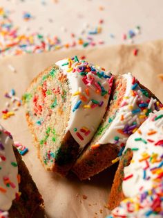 sprinkles and white frosting are on top of the cake slices that have been cut in half