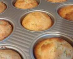 muffins in a metal pan sitting on top of a counter