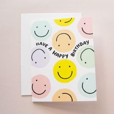 a happy birthday card with smiley faces on it