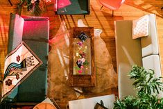 an overhead view of a living room with couches, chairs and other decorations on the floor