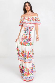 A printed maxi dress featuring off shoulder, elasticized waist with self sash and tiered skirtDetailsSelf: 100% Rayon,, 100% PolyesterSize & Fit- Model is 5`8" And Wearing Size Small- Measurements Taken From Size Small- Approx. Length: 52.5" Flowy Long Floral Dress, Feminine Floor-length Beach Maxi Dress, Feminine Boho Maxi Dress For Vacation, Flirty Summer Maxi Dress For Garden Party, Flirty Spring Maxi Dress For Garden Party, Flirty Maxi Dress For Summer Garden Party, Feminine Fitted Maxi Dress For Vacation, Flirty Maxi Dress For Spring Garden Party, Casual Printed Bohemian Dress