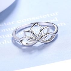 The Sterling Silver Lotus Flower Ring is a beautiful piece of jewelry that symbolizes purity, enlightenment, and rebirth. The lotus flower has a deep spiritual meaning in many cultures and religions, and this ring is a stunning representation of that symbolism. The ring features a detailed lotus flower design that is expertly crafted from high-quality sterling silver. The intricate details of the lotus petals and the central stamen create a sense of depth and dimension, giving the ring a unique Lotus Flower Ring, Lotus Ring, Lotus Flower Design, Coffee And Espresso Maker, Interesting Design, The Lotus, Spiritual Meaning, Flower Ring, Gold Design