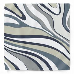 a white and grey wall hanging with an abstract design