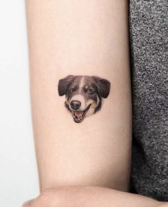 a dog's face is shown on the arm