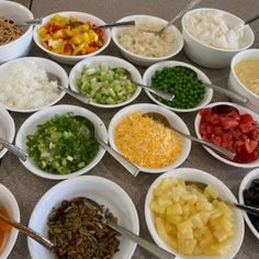 several bowls filled with different types of food