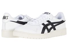 a white and black sneaker with the word asics written on the upper part