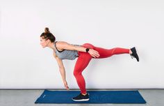 a woman in red leggings is doing an exercise on a blue mat