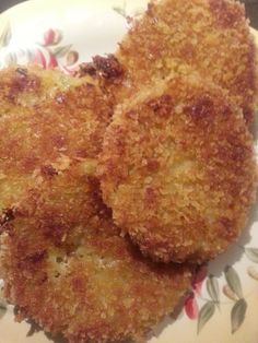 three fried food items on a floral plate