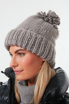 Look by M makes quality knit pieces at an accessible price point that allows them to be worn and loved by all. These scarves, hats, ponchos, and other knit goods make a great gift for friends and family, so we are huge fans.Who doesn't love a classic pom beanie for the season? The Grey Hand Knitted Basic Hat is a comfy and cozy number that'll keep you warm in a neutral colorway that will match any outfit. Pair it with a puffer coat for the coolest of days or a warm fleece to sit by the fire and Merino Wool Hat For Cold Weather, Knitted Hats For Cold Weather, Comfortable Knitted Hats For Cold Weather, Casual Merino Wool Hat, Casual Hand Knitted Merino Wool Hat, Knitted Merino Wool Hat For Cold Weather, Casual Hand-knitted Merino Wool Hat, One Size Knitted Beanie For Cold Weather, Winter Merino Wool Hat One Size