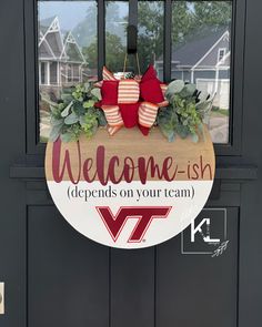 a welcome sign hanging on the front door