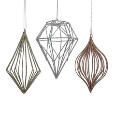 three metal ornaments hanging from strings on a white background, each with an ornament in the shape of a diamond