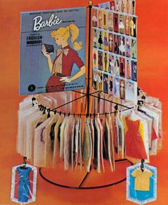 an advertisement for barbie clothes hanging on a rack with pictures and tags attached to it