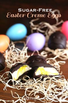 chocolate covered eggs sitting on top of a wooden table