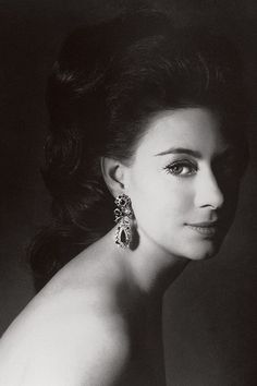 black and white photograph of a woman wearing earrings