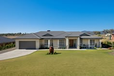 a house with a large lawn in front of it