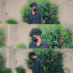 a man wearing a face mask in front of some plants