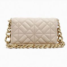 Nwot Zara Quilted Shoulder Bag With Chain Color: Nude/ Beige Shoulder Bag With Quilted Exterior. Thick Chain Shoulder Strap. Lined Interior With Pocket. Magnetic Closure. Vegan Leather H X L X W: 5.3 X 8.1 X 2 Inches (13.5 X 20.5 X 5 Cm) Metal Chain 10" Inches Strap Beige Square Bag With Chain Strap, Beige Square Shoulder Bag With Chain Strap, Rectangular Phone Bag With Chain Strap, Trendy Cream Bag With Chain Strap, Chic Gold Crossbody Phone Bag, Chic White Flap Bag With Chain Strap, White Chic Flap Bag With Chain Strap, Evening Phone Clutch With Chain Strap, White Flap Shoulder Bag With Chain Strap