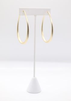 Matte gold teardrop earrings feature a sleek and smooth finish with a subtle sheen, providing a sophisticated yet understated elegance. Their teardrop shape offers a classic and timeless design, making them versatile for both casual and formal occasions. Chic Oval Earrings For Formal Occasions, Minimalist Formal Teardrop Earrings, Formal Teardrop Hoop Earrings, Classic Pear-shaped Hoop Earrings For Formal Occasions, Minimalist Teardrop Earrings For Formal Occasions, Chic Teardrop Earrings For Formal Occasions, Teardrop Yellow Gold Hoop Earrings For Party, Classic Drop Hoop Earrings For Formal Occasions, Minimalist Pear-shaped Teardrop Earrings For Formal