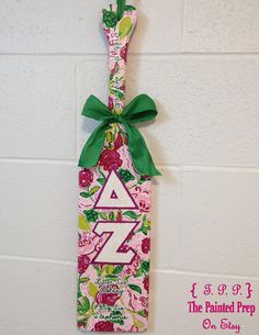 a pink and green door hanger with the letter z on it's side