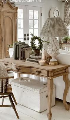 a desk with a lamp and some books on it