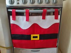 an oven with a santa claus bag hanging from it's front and bottom rack