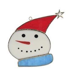 a glass ornament with a snowman's hat and star on top