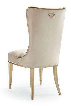 a white chair with gold legs and a beige upholstered back, on a white background