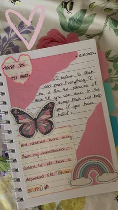 an open notebook with a poem written in it and a butterfly sitting on top of the page