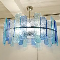 a blue chandelier hanging from the ceiling