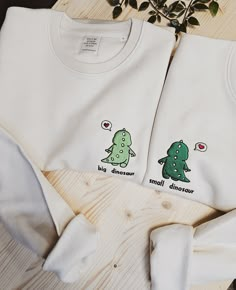 Custom couple sweatshirts with dino. You can customize colors of dino's and sweatshirt, text and place of the text.  If you would like to have an oversized look you need to size up.  Welcome to our Etsy shop where sustainability meets style! Our Unisex Organic Cotton Embroidery sweatshirts are the perfect addition to any eco-conscious wardrobe. Crafted from premium quality organic cotton, these sweatshirts are not only comfortable but also gentle on the environment. We take sustainability seriously and we want you to feel good about your purchase. That's why we use organic cotton which is grown without the use of harmful chemicals or pesticides, making it a safer and healthier option for both you and the environment. Our Unisex Organic Cotton Embroidery sweatshirts features intricate embro Sweatshirt Ideas For Couples, Matching For Best Friends, Cute Couples Gift Ideas, Matching Sweatshirts For Couples, Sweatshirts For Couples, Matching Shirts For Couples, Couple Embroidery, Matching Crewneck, Couple Sweatshirts