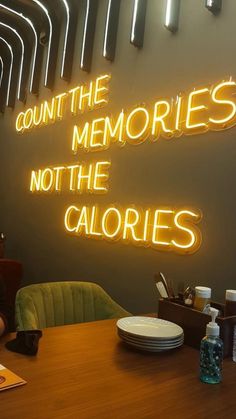 a neon sign that reads, count the memories not the caloriess on it