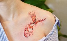 a woman with a bird tattoo on her shoulder