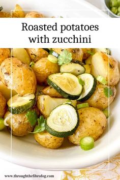 roasted potatoes with zucchini in a white bowl